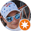 Man wearing sunglasses and a white cap.